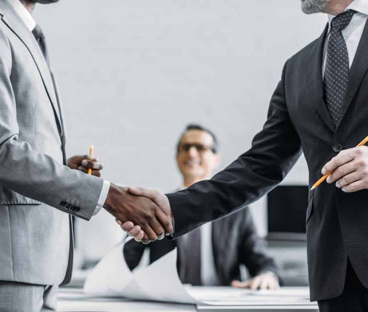two persons shaking hands